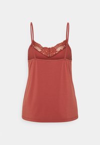 Camisole couleur rouille avec bretelles spaghetti réglables, ornée d'un panneau en dentelle au niveau du décolleté et d'une coupe ajustée et lisse.