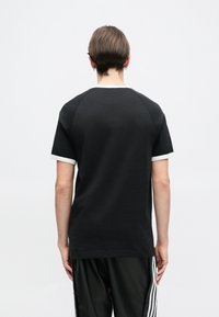 adidas Originals RINGER TEE UNISEX - Tričko s potlačou - black