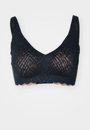 Black lace bralette with a geometric pattern, soft texture, scalloped edges, and adjustable straps. Unlined with a V-neck design.