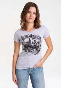 Gray short-sleeve T-shirt featuring a black graphic design of a castle surrounded by leaves and flowers, with the text "Hogwarts" at the bottom.