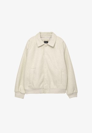 Vaaleanharmaa villasekoite takki, jossa on kaulus, etunapit, kaksi sivutaskua ja ribbireunukset helmassa. Pehmeä pinta, rento mitoitus.