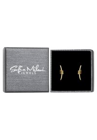 Guldörhängen med en tvinnad knutdesign, visade i en grå texturerad låda med svart inredning och vittryckt logotyp.