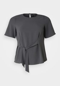 Gray short-sleeve blouse with a rounded neckline, a tied waist detail, and a soft drape. Features a back button closure and smooth texture.