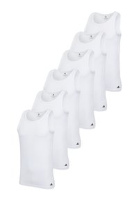 Six white tank tops made of smooth fabric feature a round neckline and wide armholes, with a small black logo at the lower left corners.