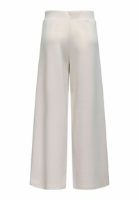 Løse bukser i lysebeige stof med elastisk talje og glat tekstur, designet til komfort med en enkel, minimalistisk stil.