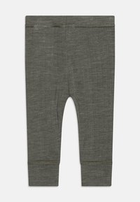 Grå, lette tights med en teksturert overflate. Elastisk midjebånd og sydd sømmer ved mansjettene, designet for komfort og fleksibilitet.