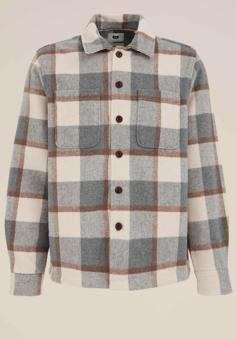 Koszula flanelowa w kratę w odcieniach kremowego, szarego i brązowego. Posiada zapięcie na guziki, dwie kieszenie na piersiach oraz spiczasty kołnierz. Miękka faktura.