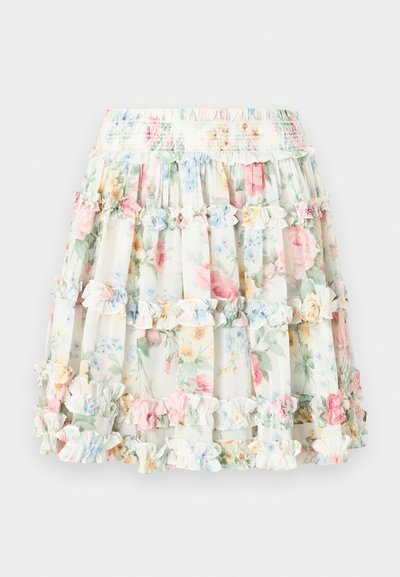 Floral tiered skirt with a cream background featuring pastel pink, blue, and green flowers. Elastic waistband with ruffled accents.