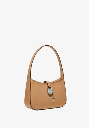 Small tan leather handbag with single strap and silver Michael Kors lock and key charm on front center.