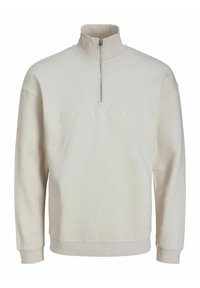 Felpa beige chiaro con collo alto a zip, con la parola "ORIGINALS" in rilievo sul davanti. Tessuto liscio e polsini a costine.