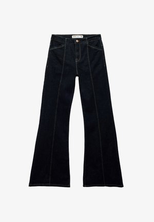 Mørkeblå flagrende jeans lavet af denim, med forlommer, knaplukning og kontrastsyninger langs sømmene.