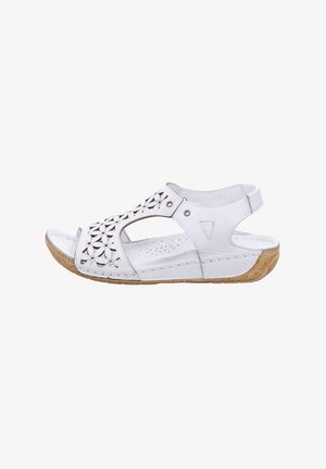 Weiße Ledersandalen mit ausgeschnittenem Blumendesign, offenem Zeh, verstellbarem Rückriemen und einer strukturierten beigen Korksohle.