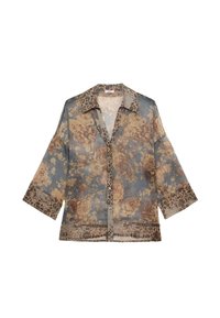 Blusa floreale trasparente blu con motivi di rose beige e marroni, maniche lunghe e chiusura a bottoni. Caratterizzata da un colletto e dei polsini a contrasto.