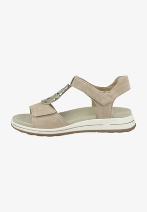 Beige Wildledersandale mit offener Zehenpartie, verstellbaren Riemen und einer dekorativen Metallakzentuierung. Leichte Sohle mit weißen und braunen Details.