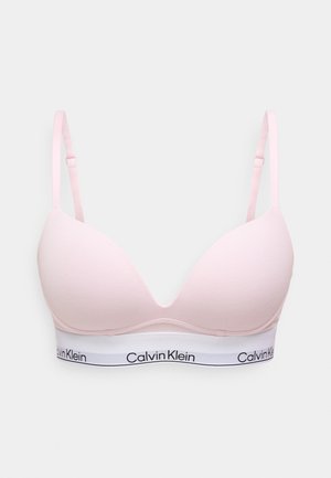 Ρόζ σουτιέν με απαλό, καλουπωτό κύπελλο και ρυθμιζόμενες τιράντες. Διαθέτει λευκή ταινία στο κάτω μέρος με μαύρο λογότυπο "Calvin Klein".