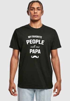 Black cotton t-shirt featuring white text that reads "MY FAVORITE PEOPLE call me PAPA" with a mustache graphic underneath.