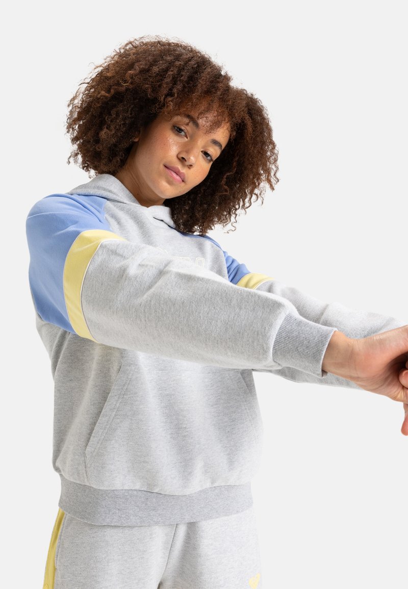 Gray hoodie with blue and yellow design accents, featuring a front pocket and ribbed cuffs. Soft fabric and relaxed fit.
