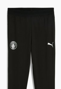 Pantalones atléticos negros con el logo del Manchester City y el logo blanco de Puma. Ajuste cómodo, apto para deportes y uso casual.