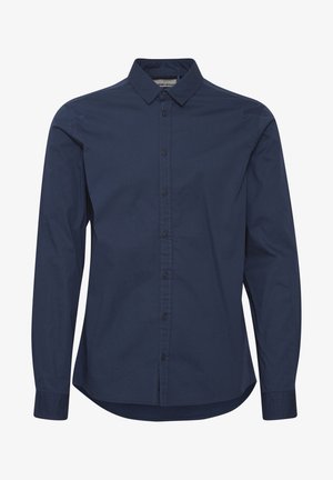 Jūrų laivyno mygtukų marškiniai, ilgomis rankovėmis, struktūrizuotu apykakle, pagaminti iš lygaus audinio, su priekiniais mygtukais ir kreiviu hemu.