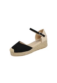 Sandalia de cuña tipo espadrille con parte delantera negra, tacón beige tejido, suela de yute trenzada y correa negra en el tobillo con hebilla plateada.