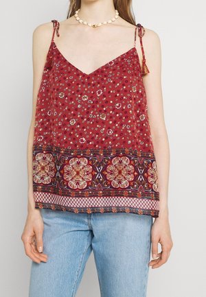 Rød blomster tanktop med justerbare bindebånd, med en mønstret kant i marineblå, creme og guldfarvede detaljer. Letvægtsstof med løs pasform.
