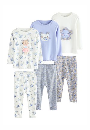 Tres conjuntos de camisetas de manga larga y leggings para niños con patrones florales y diseños de caras de animales o flores en colores azul pastel, blanco y crema.