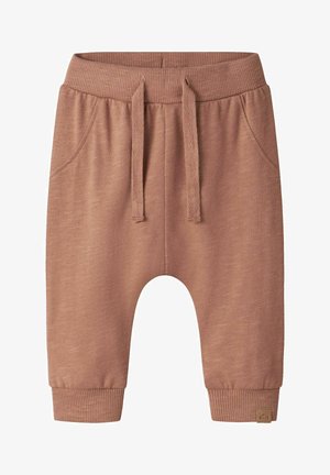 Bløde brune sweatpants til småbørn med elastik i taljen, snøre, forlommer og ribbestrikkede manchetter.