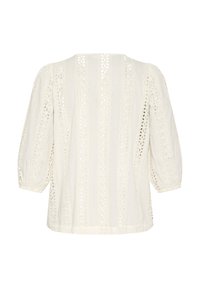 White blouse featuring a textured fabric with lace detailing, boat neckline, three-quarter sleeves, and a relaxed, slightly loose fit.