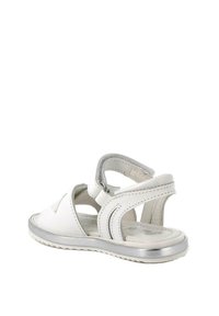 Sandali bianchi con finitura in pelle liscia, lati aperti, cinturino regolabile e suola con accenti argentati; dotati di una soletta texturizzata.