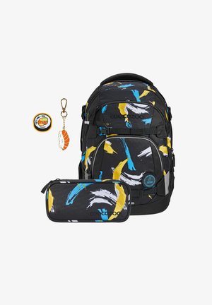 Backpack in black fabric with blue, yellow, and white abstract patterns; includes a matching pencil case and sushi-themed keychain.