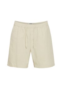 Beige drawstring shorts made of lightweight fabric, featuring an elastic waistband and a subtle texture. Mid-thigh length.
