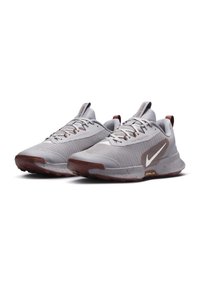 Gray athletic shoes with a textured mesh upper, brown accents, flat laces, and a speckled sole for enhanced grip and support.