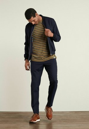 MOTION - Tracksuit bottoms - navy blue
