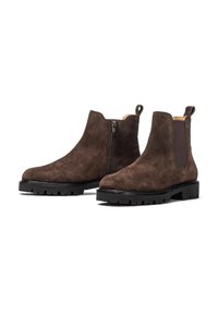 Stivaletti alla caviglia in suede marrone con cerniera laterale, pannello elastico e suola in gomma spessa con profondi intagli per una buona aderenza.