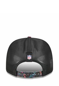 Black baseball cap with a mesh back, featuring a colorful splash pattern on the adjustable strap and an NFL logo tag.