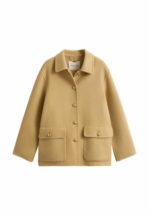 Beige wool jacket with collar, five gold buttons down front, and two large flap pockets with button closures at waist.