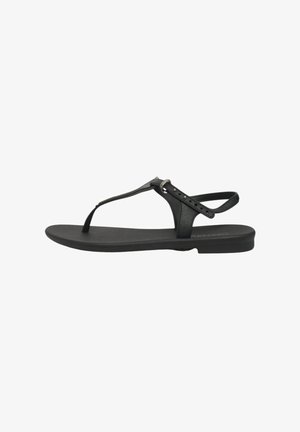 Sandali neri a infradito con suola piatta, caratterizzati da una fascia larga e piccoli accenti circolari, realizzati in materiale sintetico liscio.