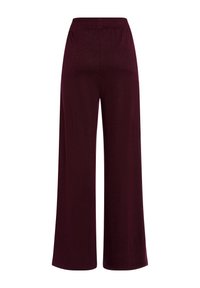 Burgundy wide-leg pants made of a textured material with an elastic waistband, featuring a smooth finish and no visible patterns or accents.