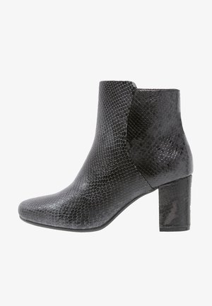 Black ankle boot with a textured snake print design, rounded toe, and a block heel. Smooth finish with a sleek silhouette.