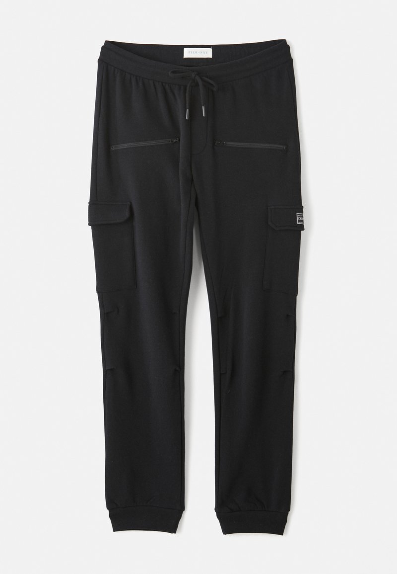 Pantalons de survêtement noirs en mélange de coton, dotés d'une taille élastique avec cordon de serrage, de deux poches zippées et de poches cargo latérales pour plus de praticité.