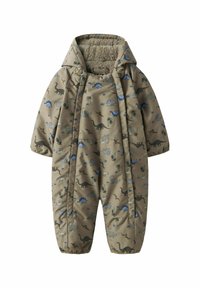 Un combinaisons beige avec des motifs de dinosaure et de palmier. Doublure douce et texturée, capuche, poignets élastiques et fermeture éclair. Convient pour un usage extérieur.