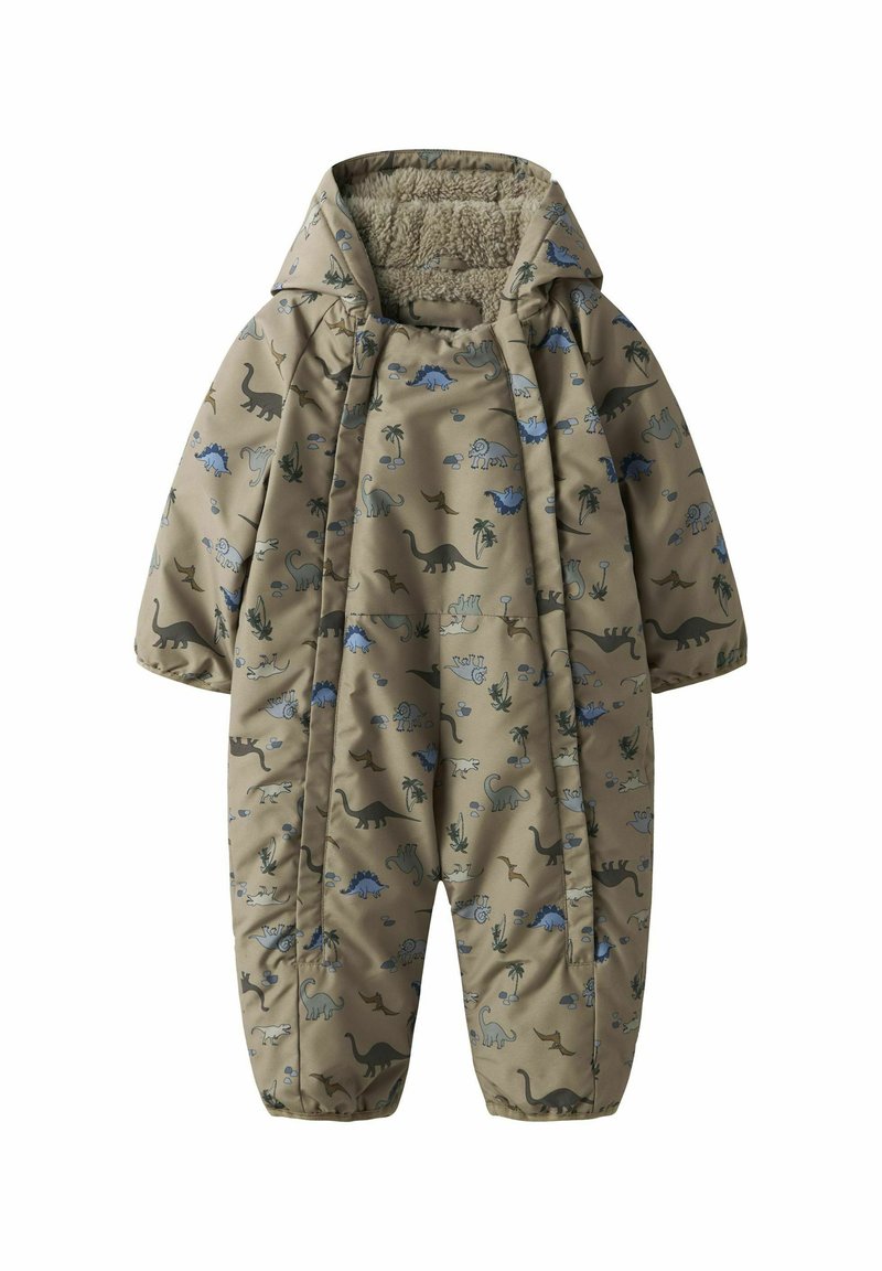 Un combinaisons beige avec des motifs de dinosaure et de palmier. Doublure douce et texturée, capuche, poignets élastiques et fermeture éclair. Convient pour un usage extérieur.