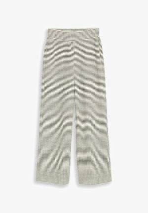 Weit geschnittene Hose mit dünnen horizontalen schwarzen Streifen auf cremefarbenem Hintergrund und elastischem Bund.