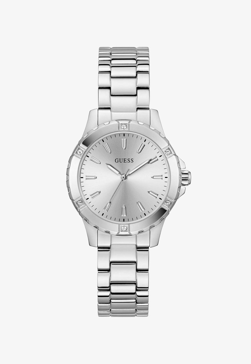 Montre en acier inoxydable argenté avec un cadran argenté texturé, des marqueurs d'heure et des accents en cristal. Elle dispose d'un bracelet à maillons et d'une couronne poussoir.