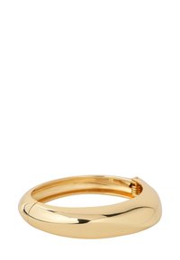 Gold bangle bracelet with a smooth, rounded design and a polished finish. Features a secure clasp mechanism for closure.