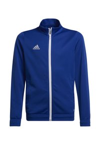Chaqueta azul de Adidas con cremallera completa y blanca, y logo en el lado izquierdo del pecho. Presenta mangas largas y un cuello alto.