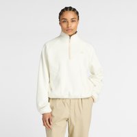 White fleece quarter-zip pullover with a high collar, side pockets, and subtle logo on the chest. Soft texture and relaxed fit.