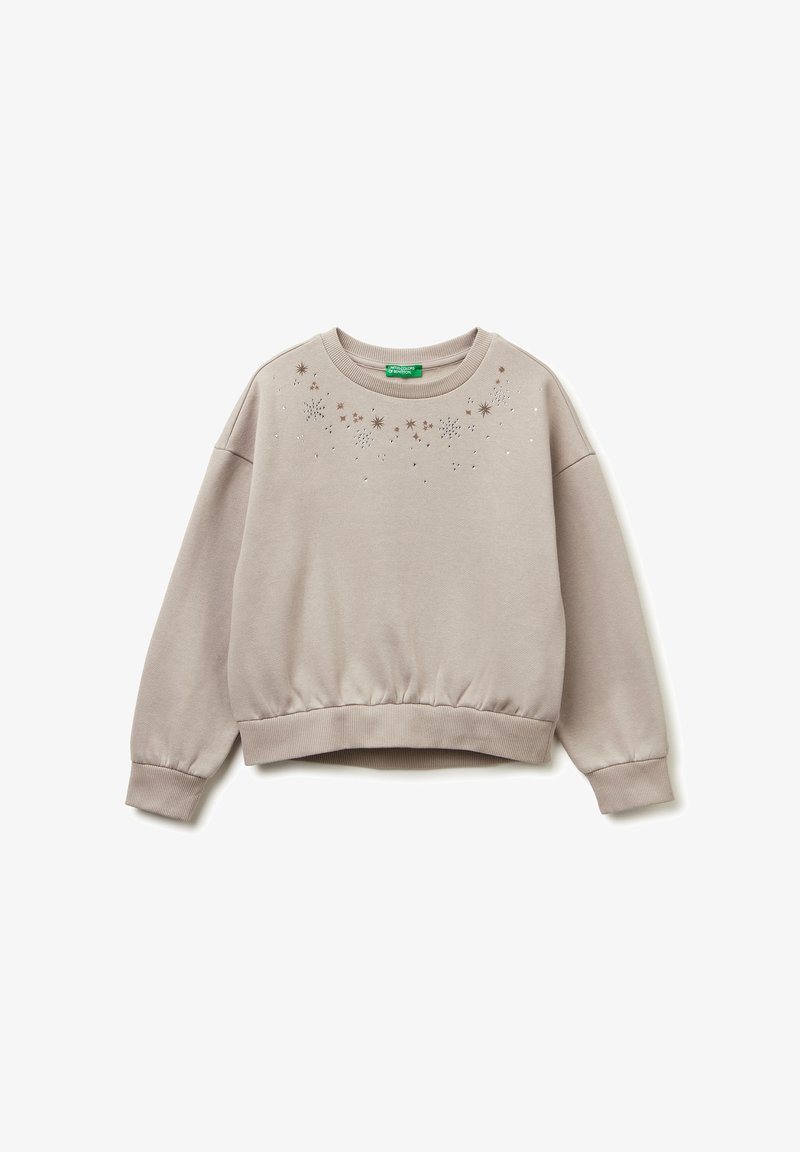 Felpa corta beige chiaro con orlo e polsini a coste, caratterizzata da motivi di stelle sparse e piccoli dettagli decorativi sul davanti.