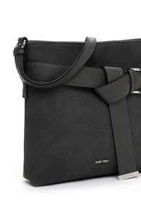 Black synthetic handbag with a textured strap, featuring a smooth finish and silver hardware. Compact rectangular shape, minimalist design.