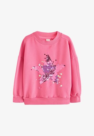 Roze sweater met lange mouwen, geribde boorden en kraag, versierd met een grote ster van meerkleurige roze pailletten aan de voorkant.